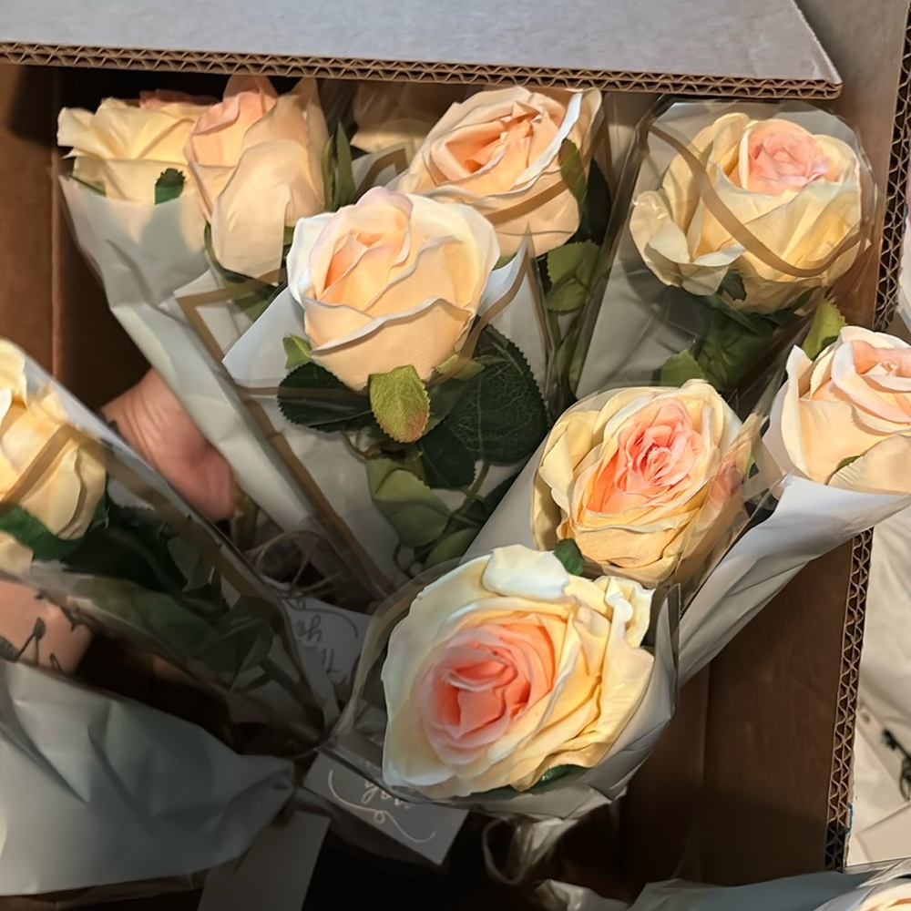 Party favors! 15 individually wrapped roses with “thank you” tag on them.